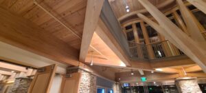 Interior view showcasing wood laminate beams by Unalam within a modern space.