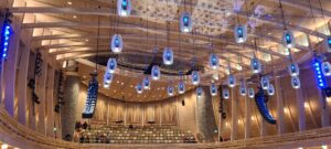 Interior of a venue featuring Unalam wood laminate construction beams and lighting.