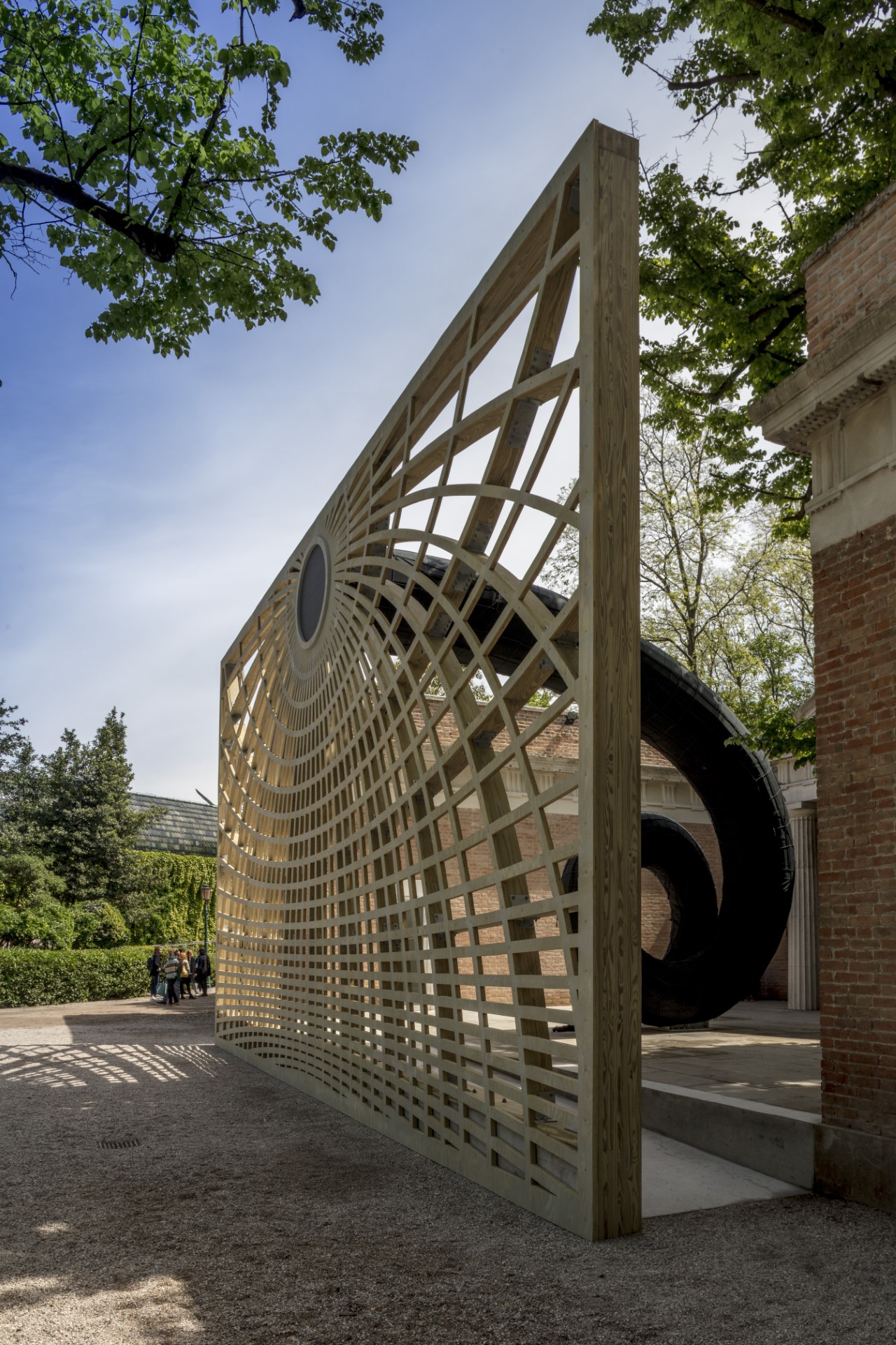 Wood laminate construction beams forming an intricate archway structure.